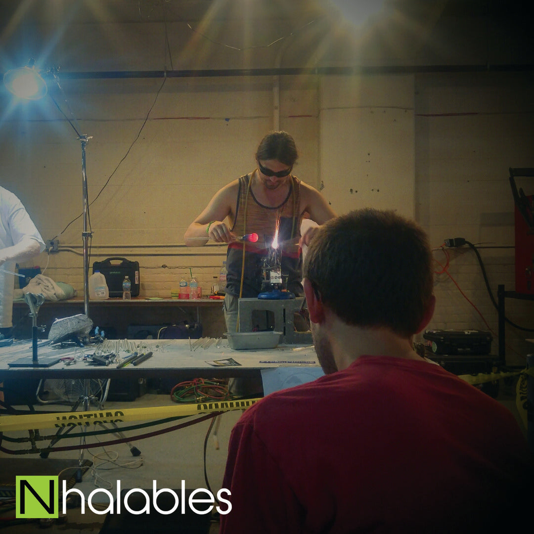 Nhalables Social Post showing Kinnickinnic Glass Doing his Glass Blowing Demo at Michigan Glass Project 2016 in Detroit Michigan.