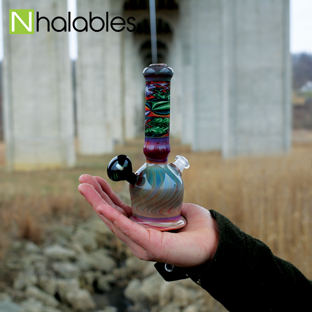 Nhalables Social Post Showing a Beautiful Collaboration between Josh Holden and Harry "Marbleman" Courtright Worked oil rig pictured under bridge 