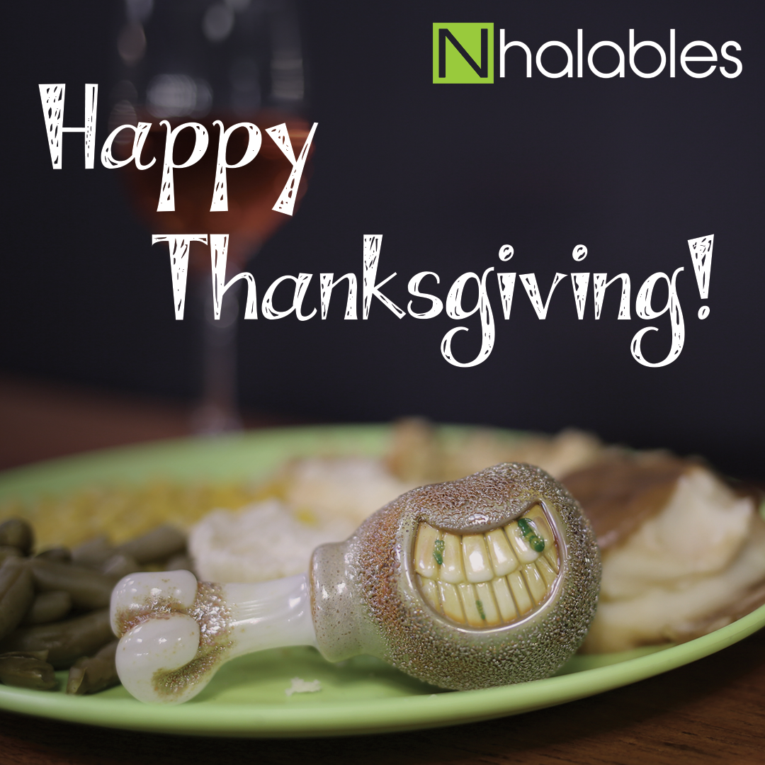 Nhalables Social Post showing the words Happy Thanksgiving. and a Rosburg Glass Turkey Leg Handpipe sitting on a Plate of food with mashed potatoes and green beans next to it.