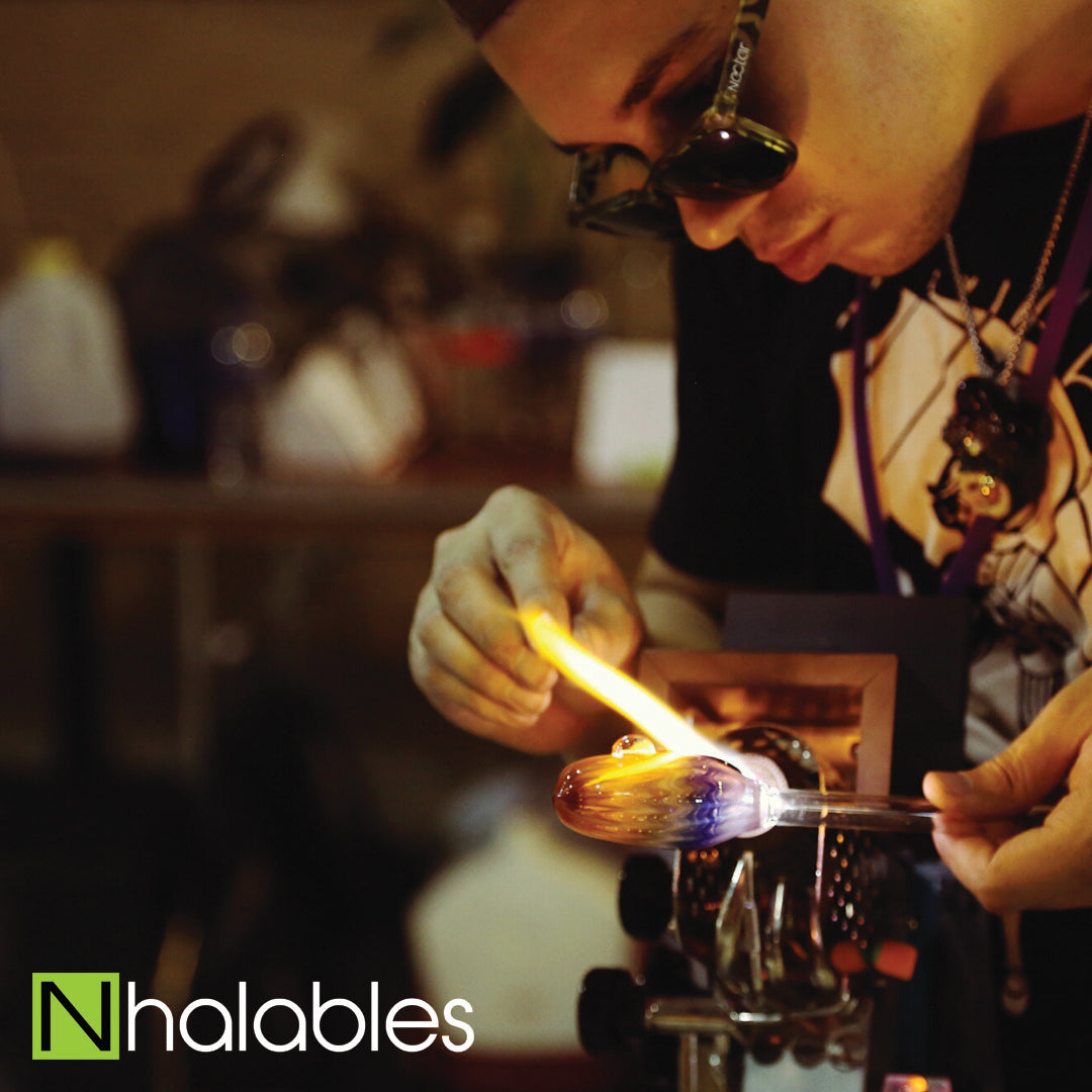 Nhalables Social Post Showing Glass Blower Firefly Glass doing his Glass Demo at Michigan Glass Project 2016 in Detroit Michigan.