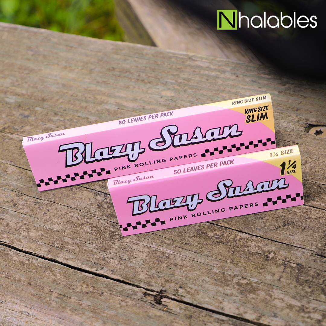 Nhalables Social image showing 2 packs of Blazy Susan rolling papers sitting on a wooden board 
